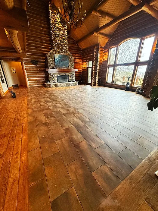 Carpet King-dark flooring in living room with fireplace